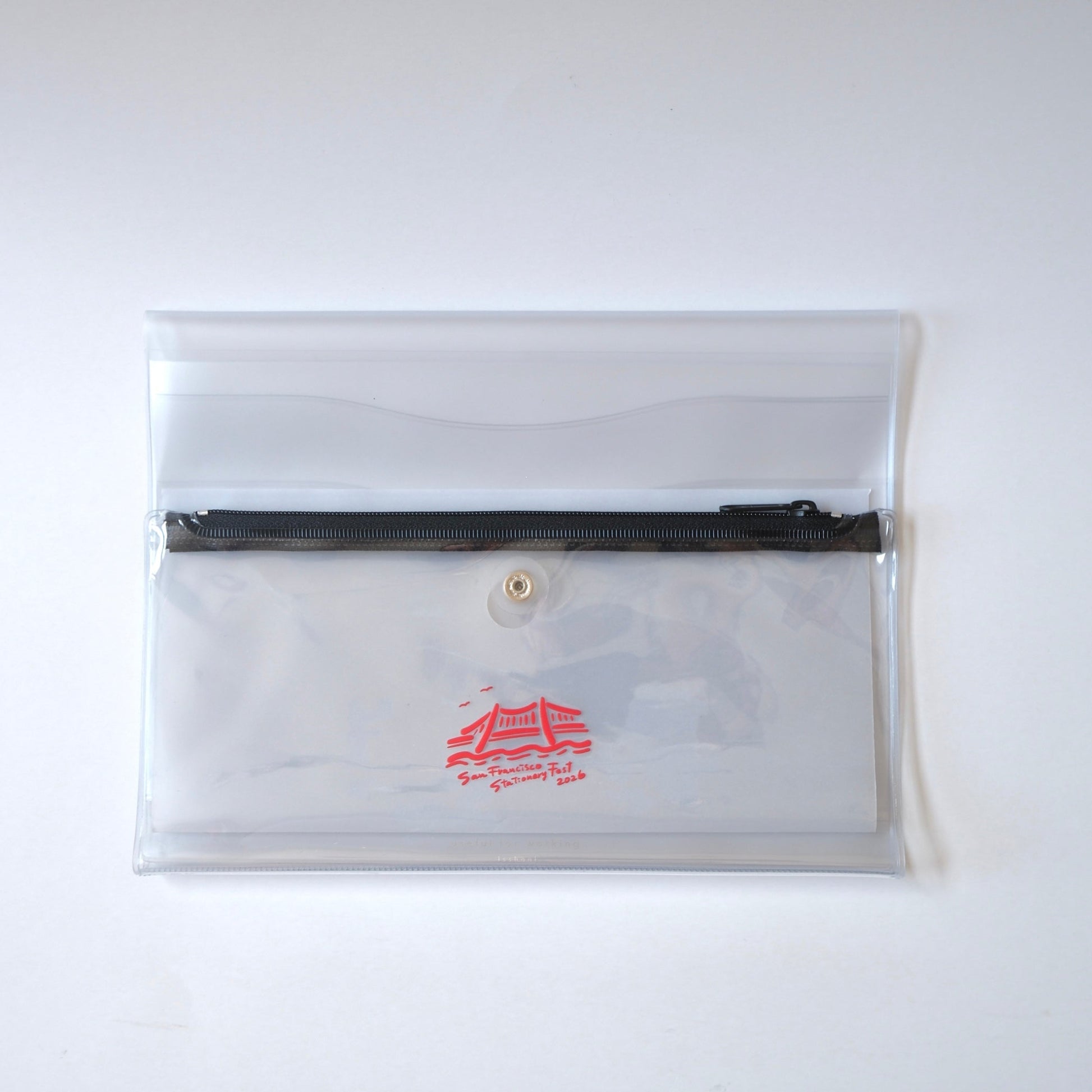 Clear pouch with a black zipper on a white background