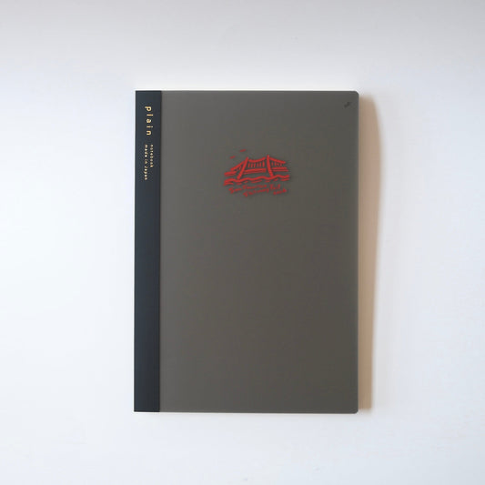 Black notebook with red logo
