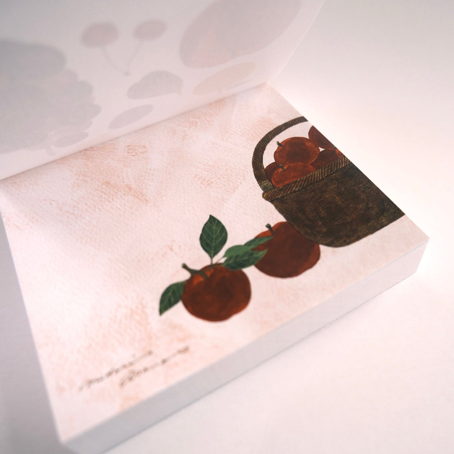 Decorative mat with a design of apples and a basket on a white background