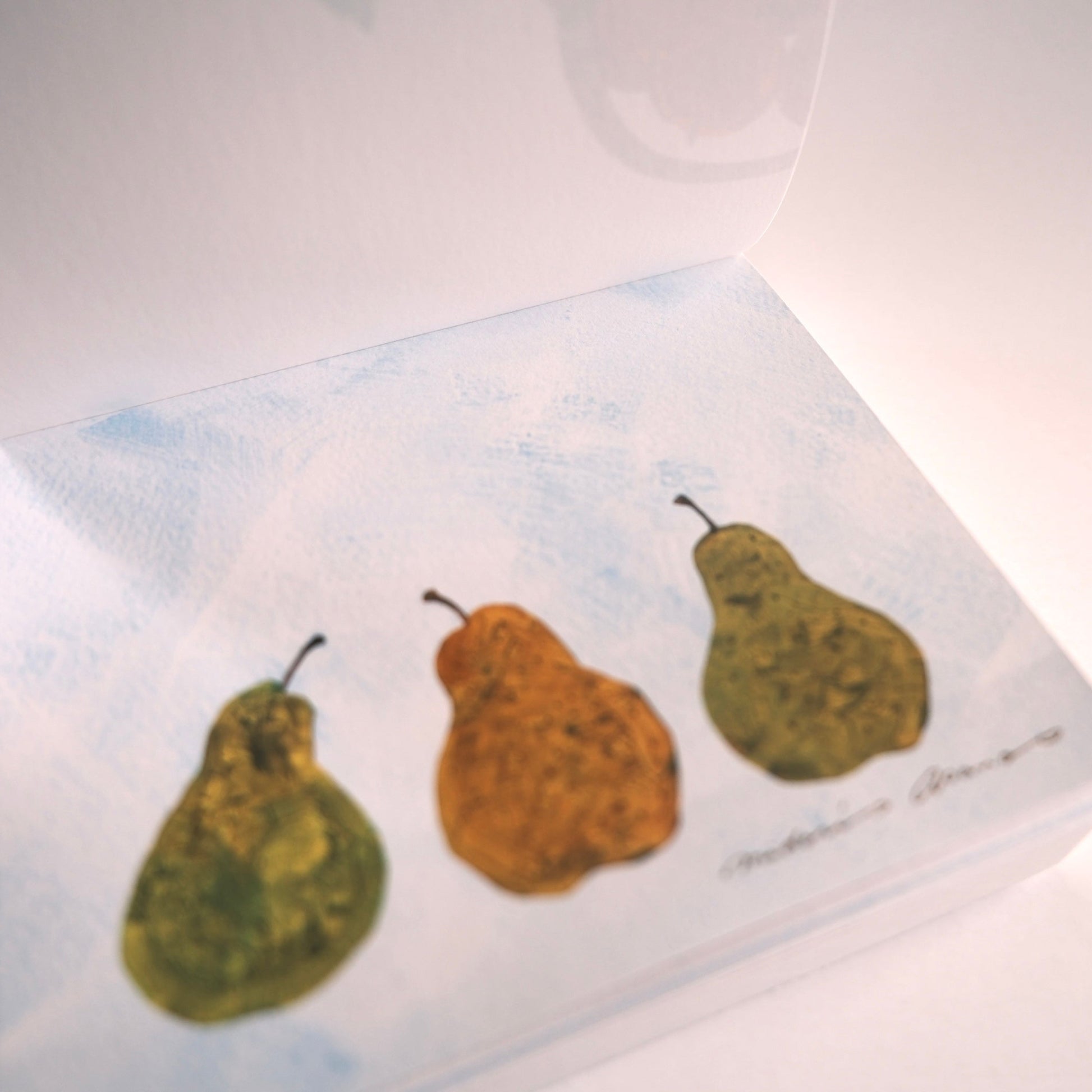Three pears on a watercolor-style card with a white background