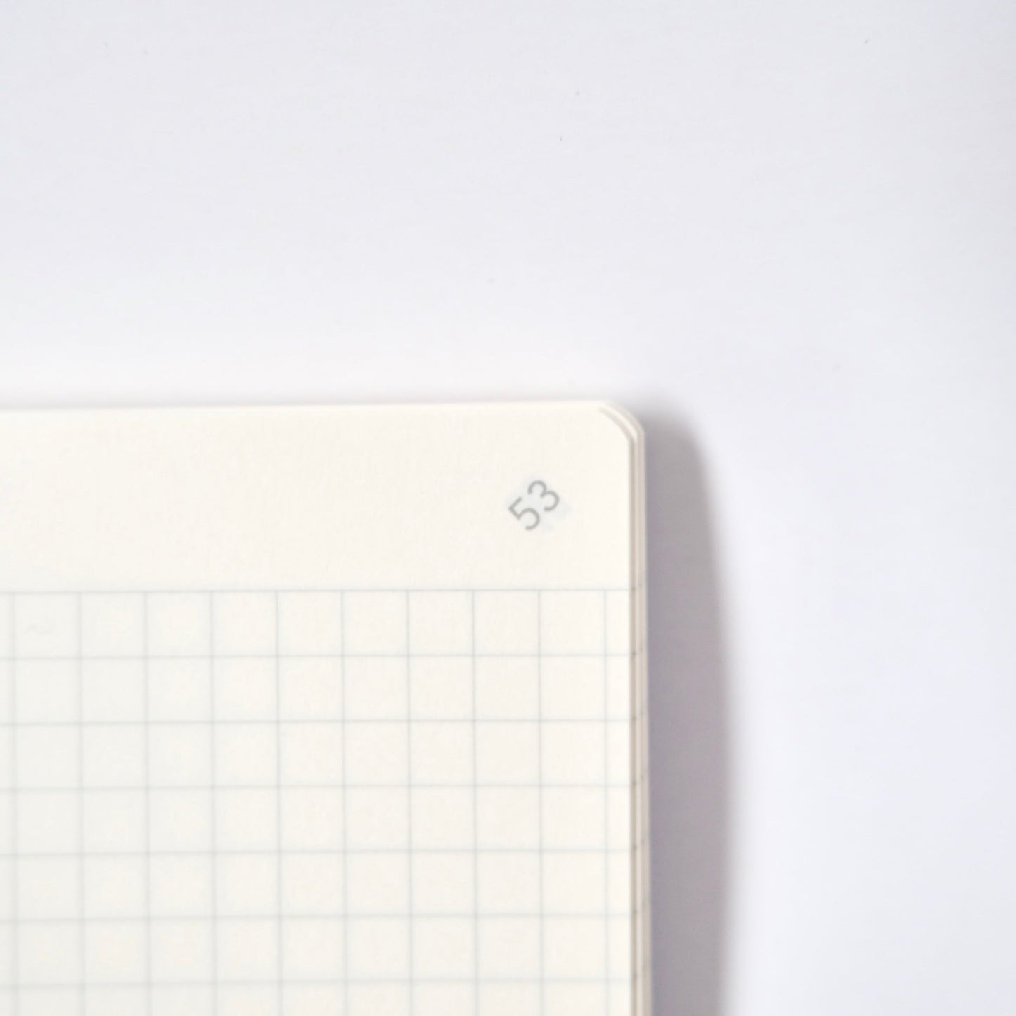 Notebook with grid pattern on a white background