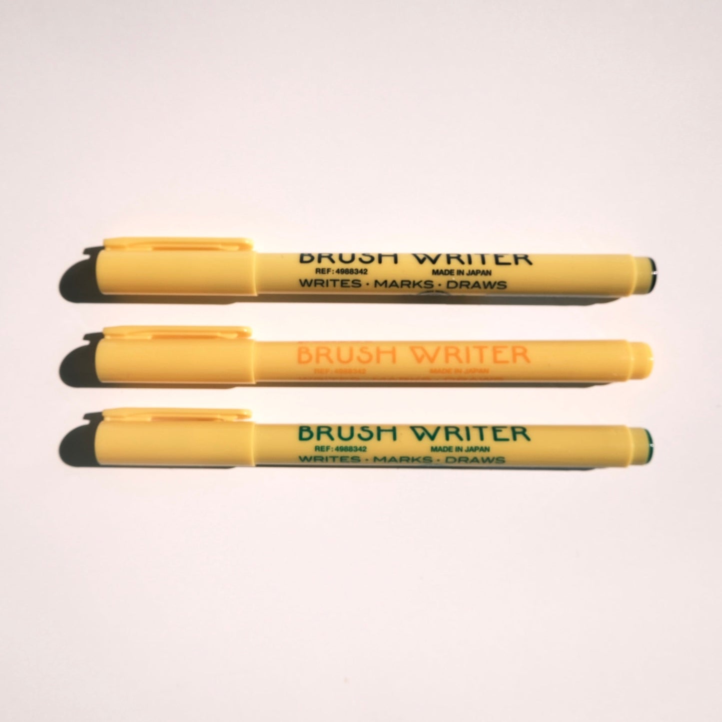 three brush writer pen hightide black yellow green