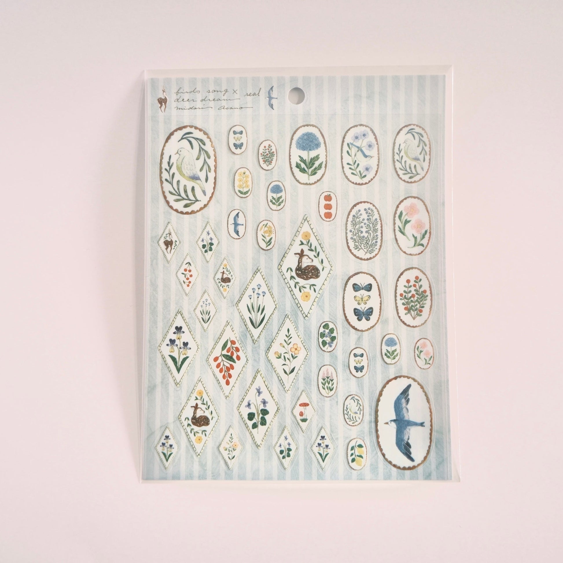 Sheet of decorative stickers with various designs on a light blue background