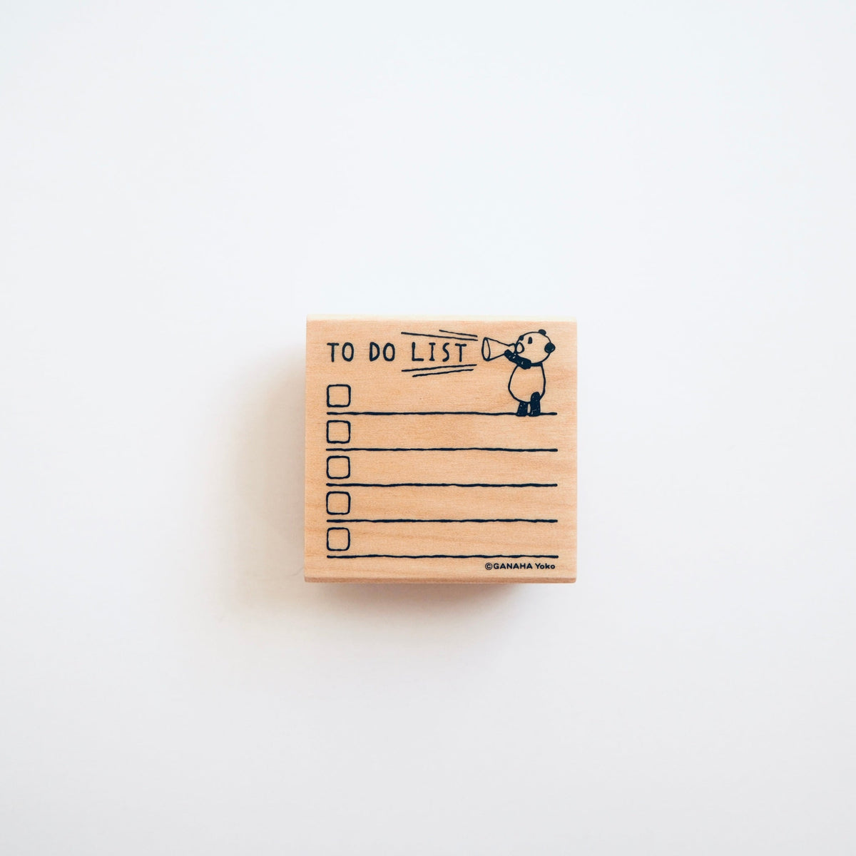 A square wooden rubber stamp featuring a black ink illustration of a panda holding a 'TO DO LIST' sign, with checklist lines and spaces on a clean white background.