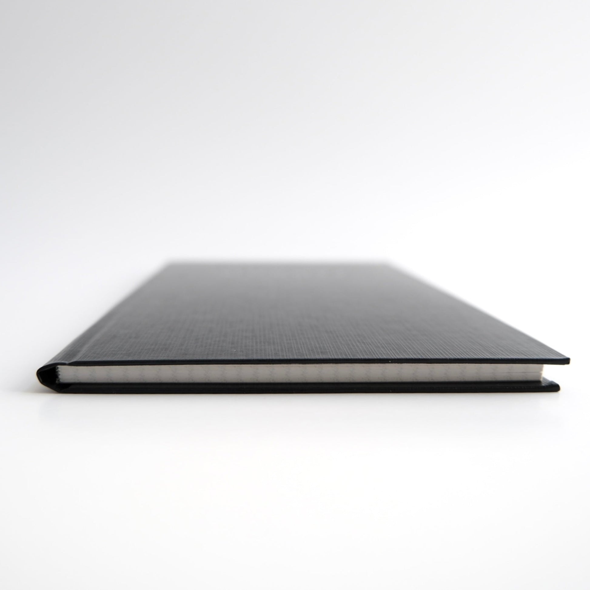 KOKUYO Field Sketch Book with 3mm graph paper and Uni Jetstream ballpoint pen, premium Japanese stationery for journaling. Compact size for carrying in a pocket or bag.