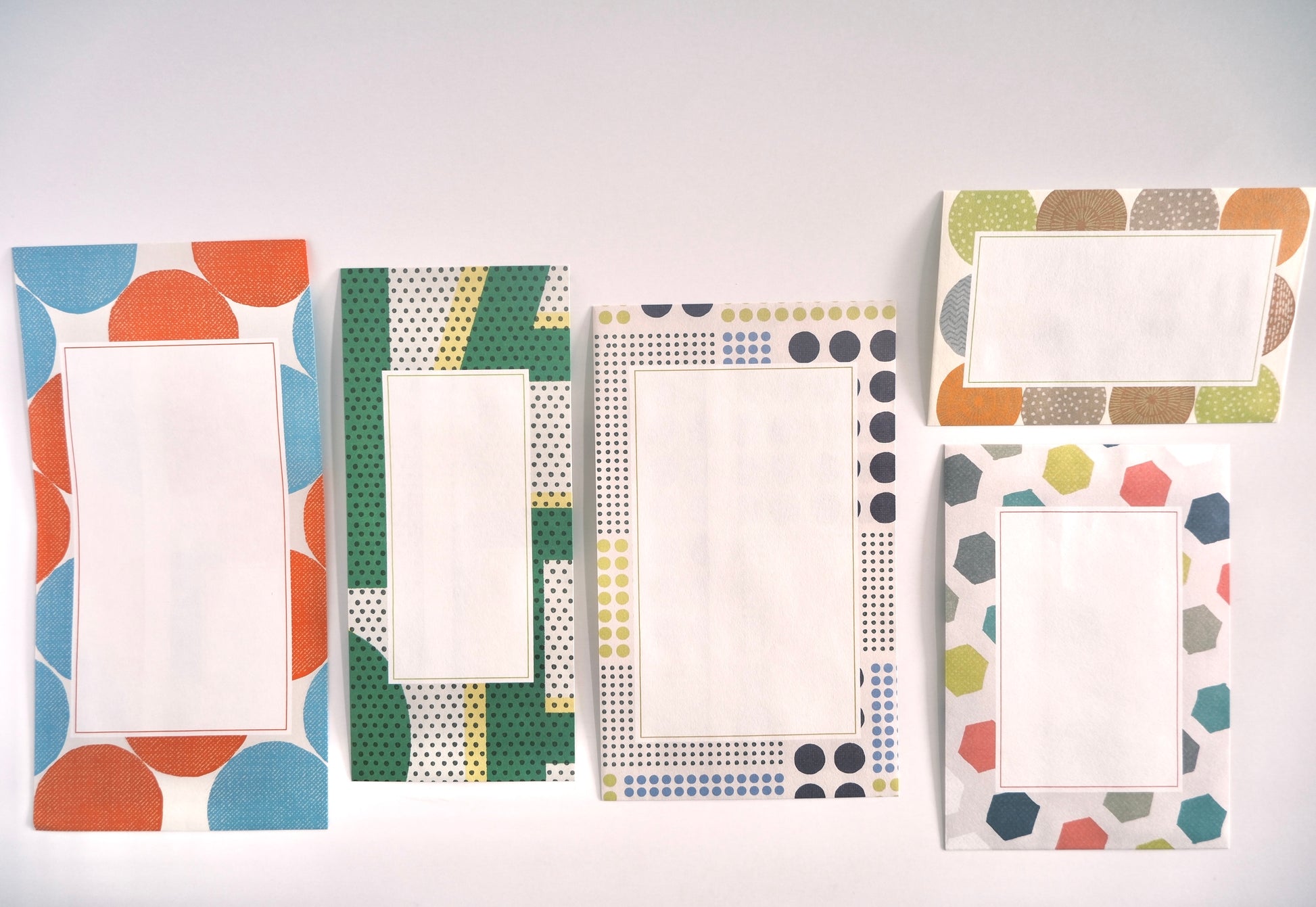 Set of colorful patterned envelopes on a white background