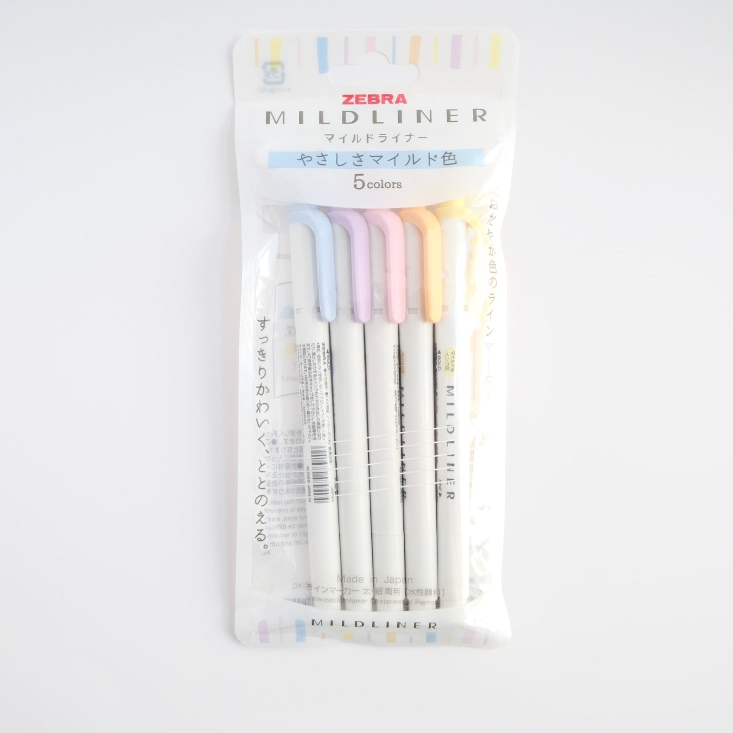 Zebra Mildliner double-sided highlighters in five gentle colors with Bande washi tape sticker roll featuring colorful bouquet design
